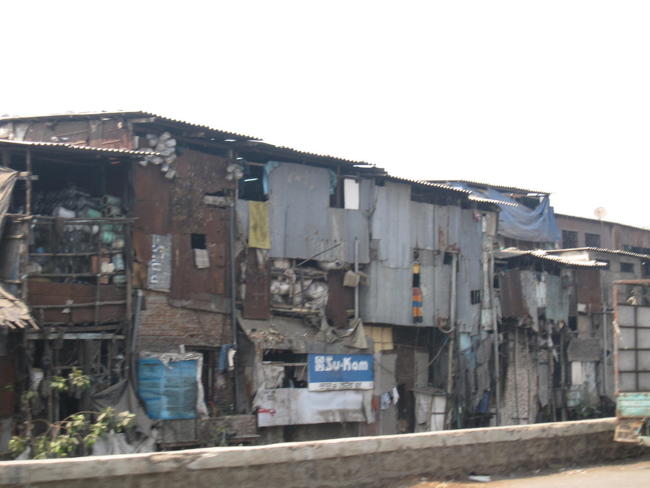 Blurry scenes of the mumbai slums near the airport. 