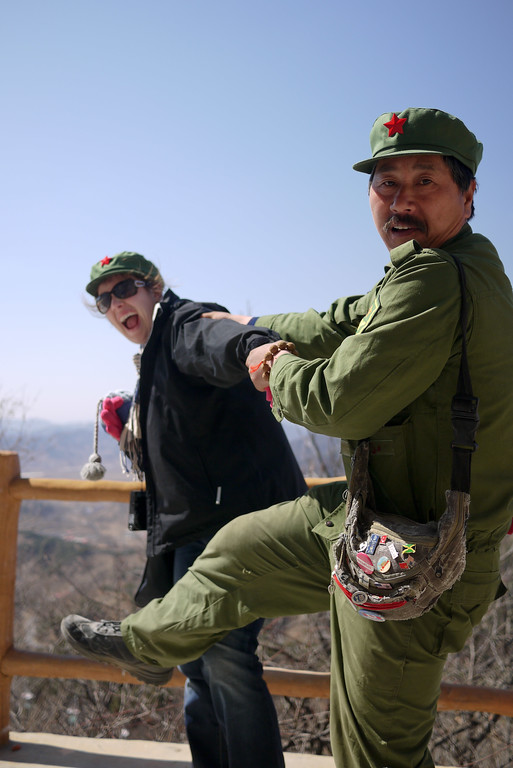 Funny vendor kicking our butts at the Great Wall of China. Funny vendor kicking our butts at the Great Wall of China.