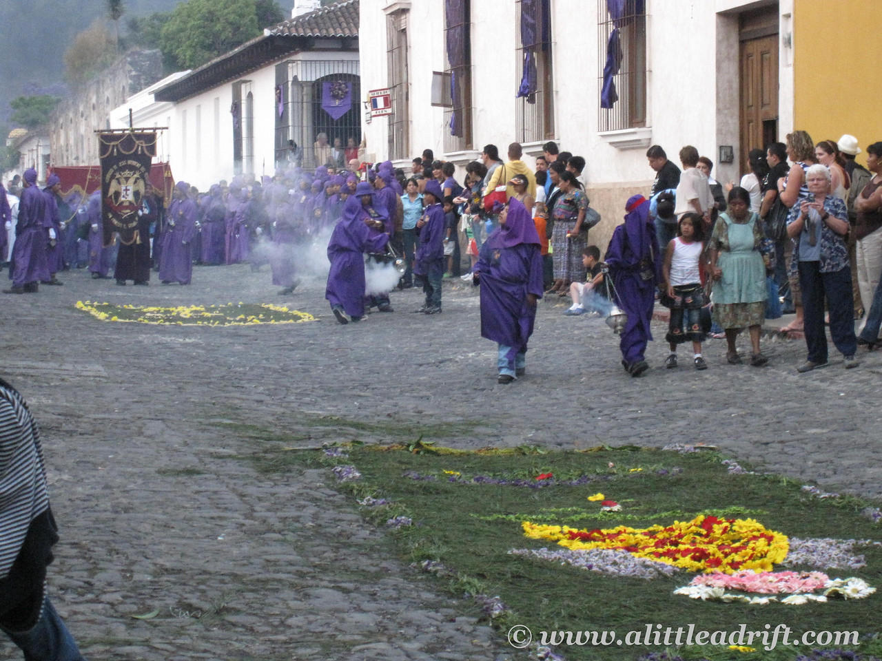 Easter procession in the streets of Antigua with incense burning and carpets