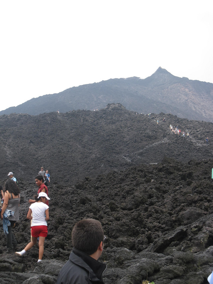 tourists snaking up pacaya volcano