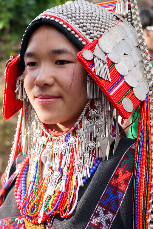 Traditionally dressed Akha villager at the Akha Ama coffee village near Chiang Mai, Thailand.