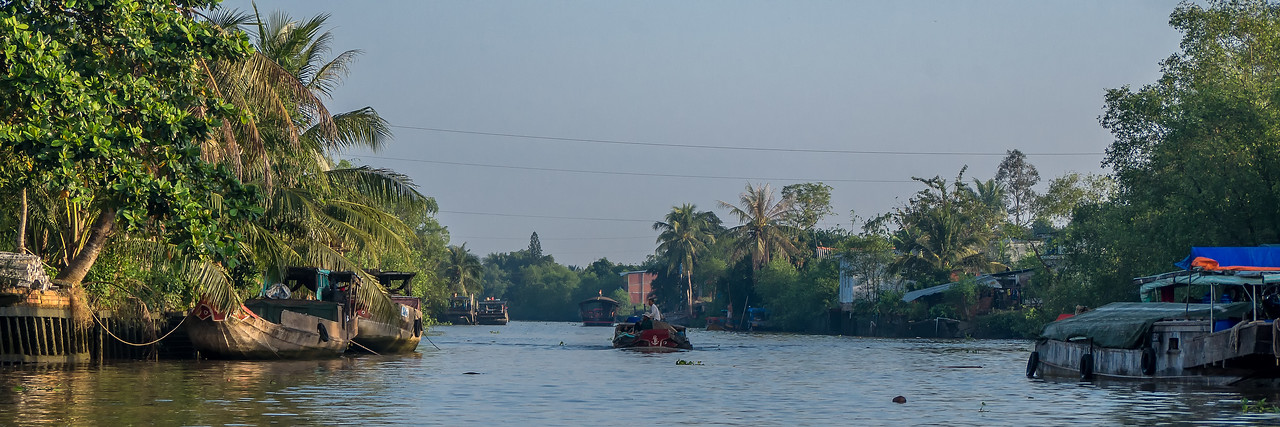 Sunrise boat traffic on the Cổ Chiên River.