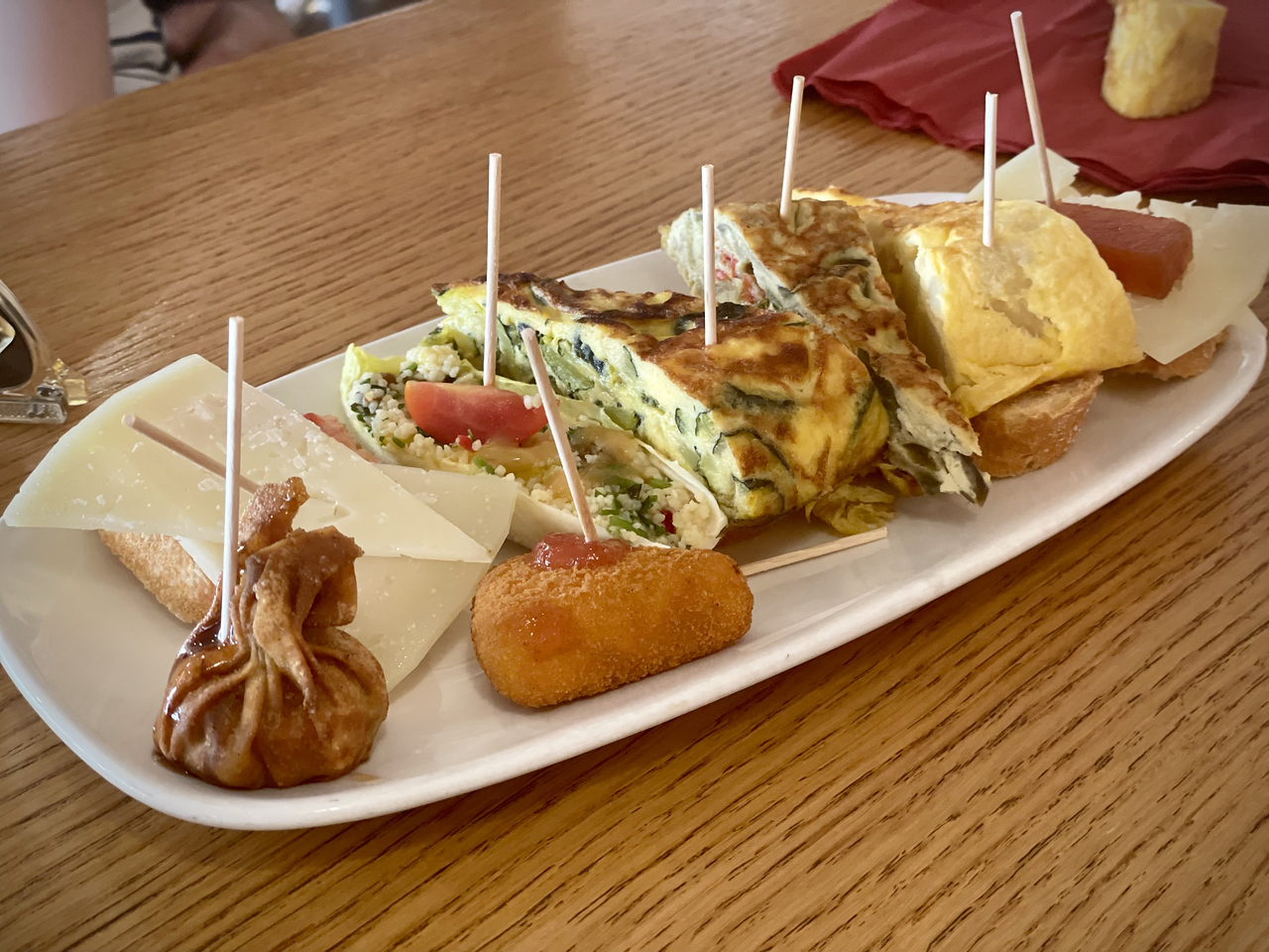 plate of pinchos in spain, where the cost of eating is low