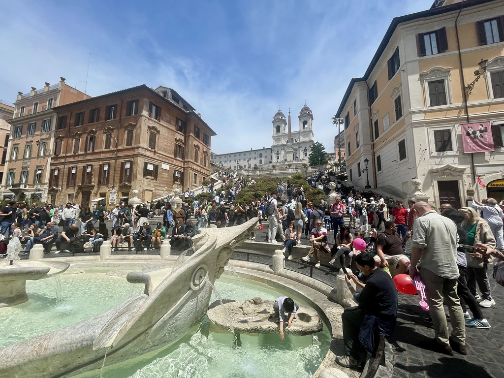 fountain below the spanish steps where kids can touch the water