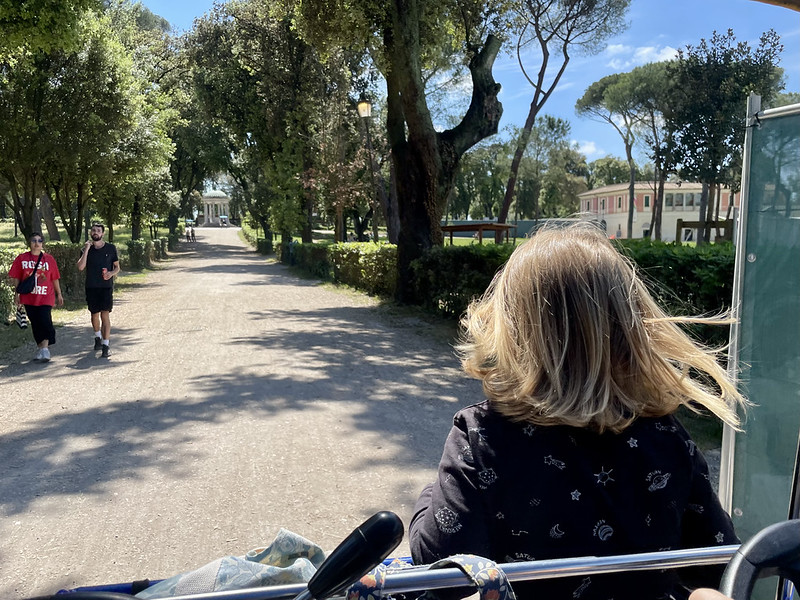 Driving through Rome's Villa Borghese gardens on a pedal-assist bike. 