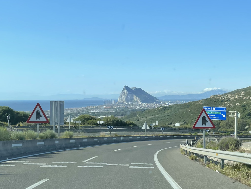 View of the Rock of Gibraltar rising above the landscape as seen from the highway approaching Gibraltar.