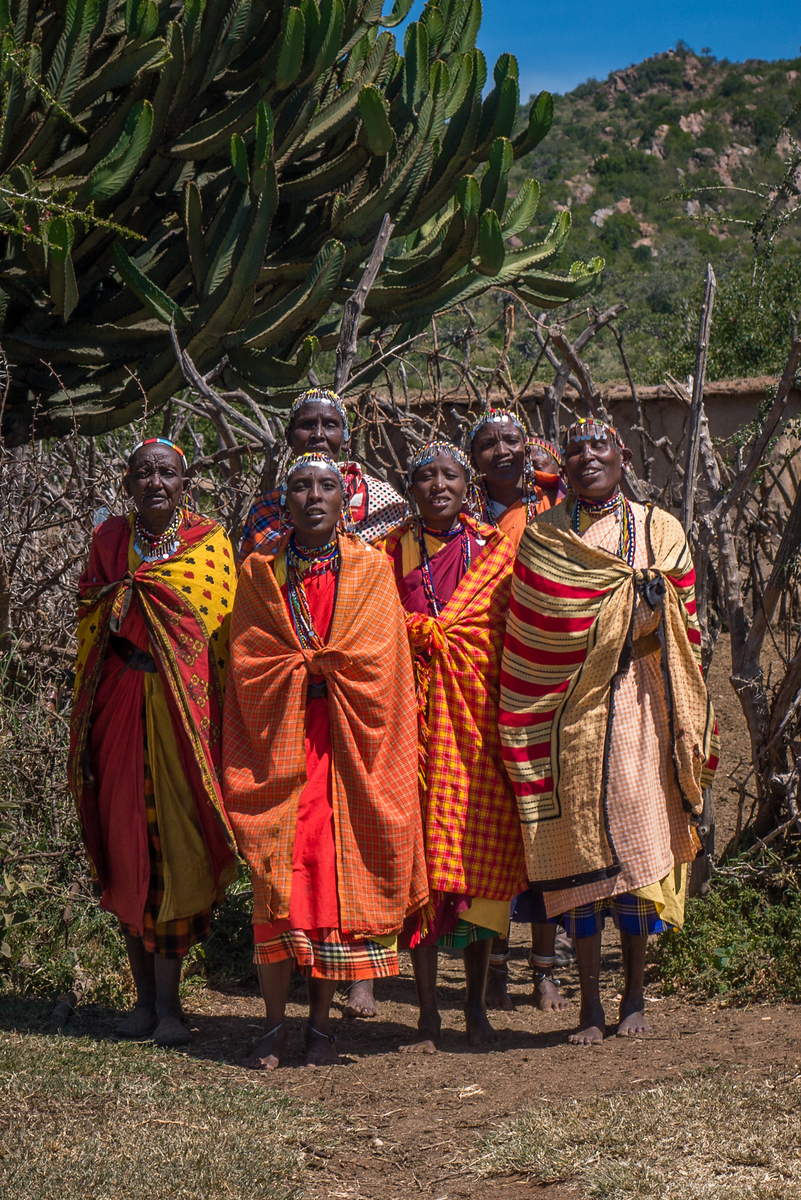 Women singing their hellos at the Widow's Village