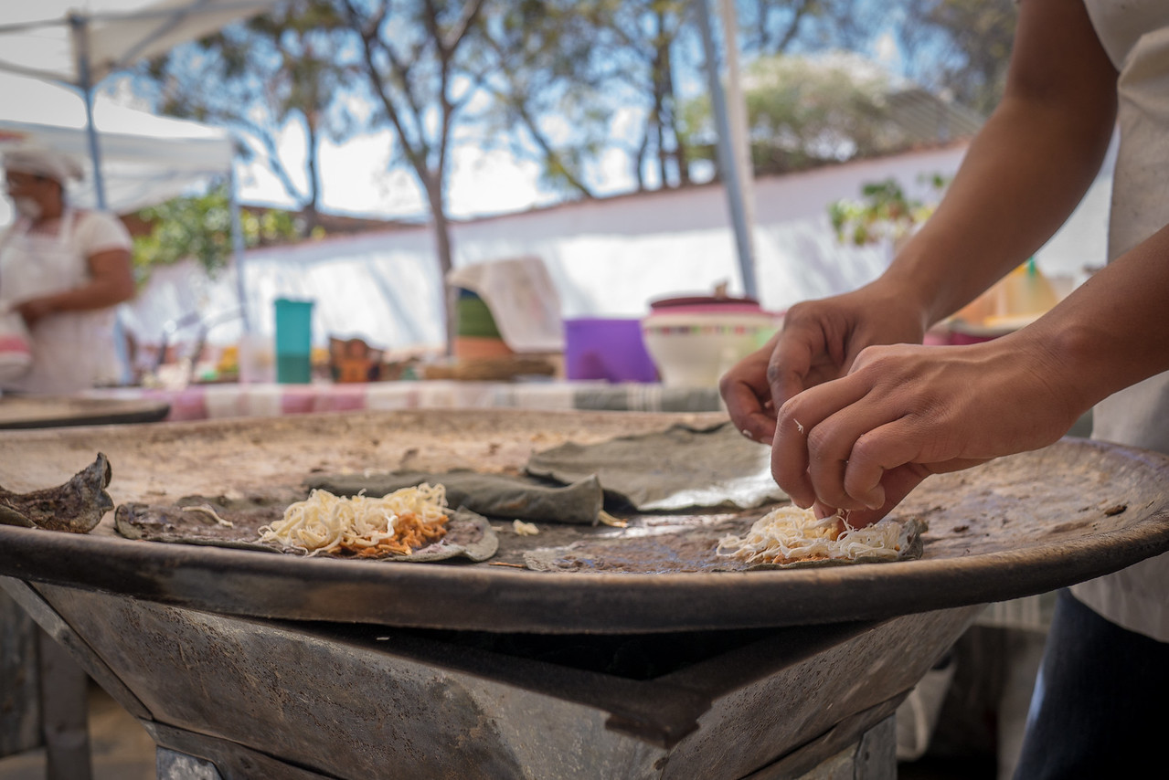 quesadilla cooking at a local street food market that happens every weekend in Oaxaca City 