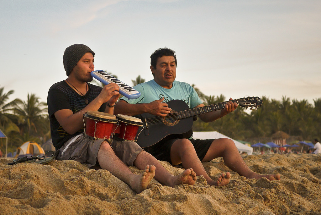 Musicians serenade the beach goers