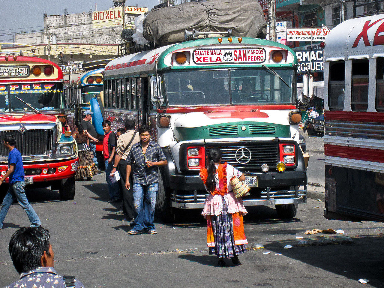 Colorful Guatemalan chicken bus adorned with vibrant decorations.