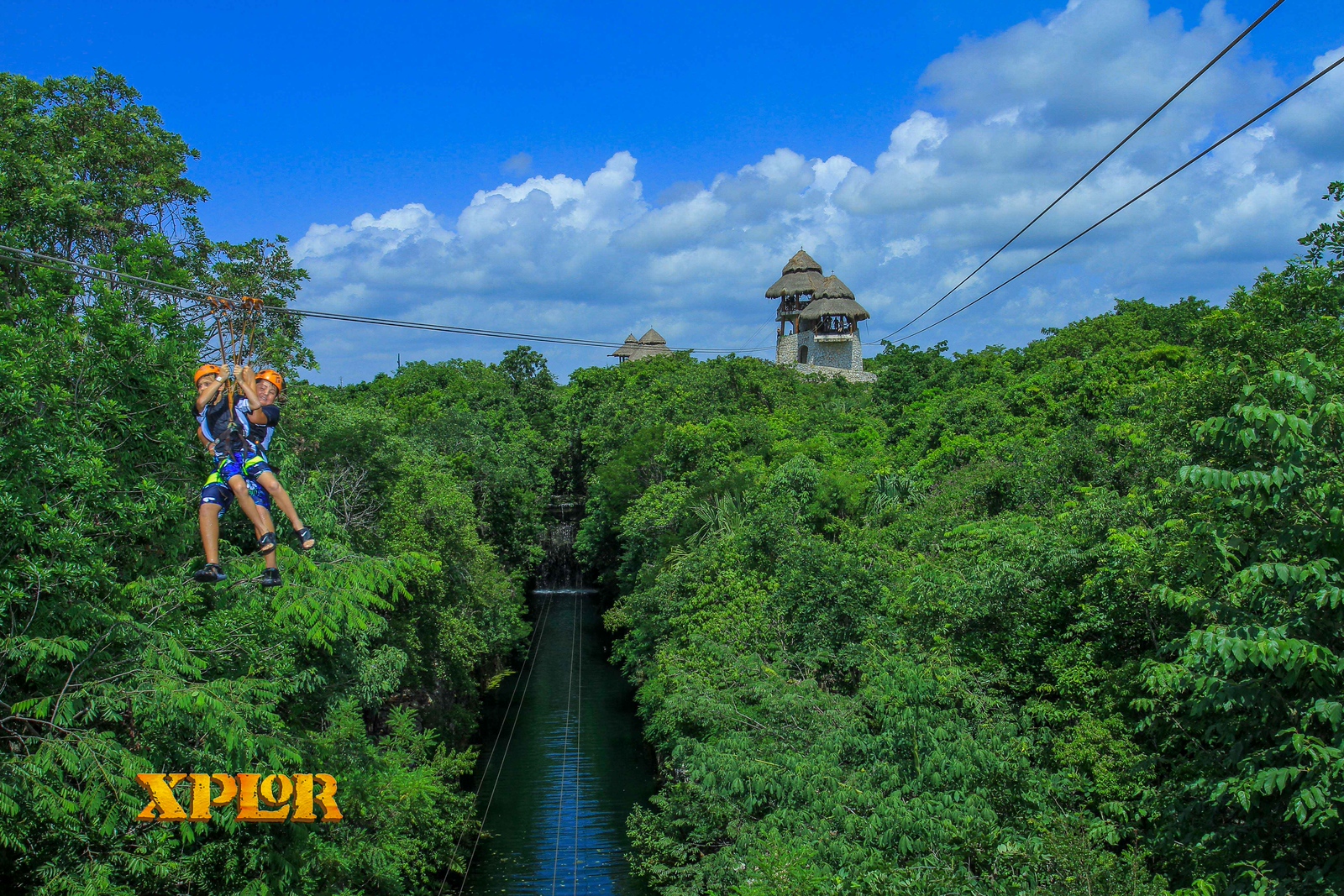 The boys together zipping over the jungle at Xplor.
