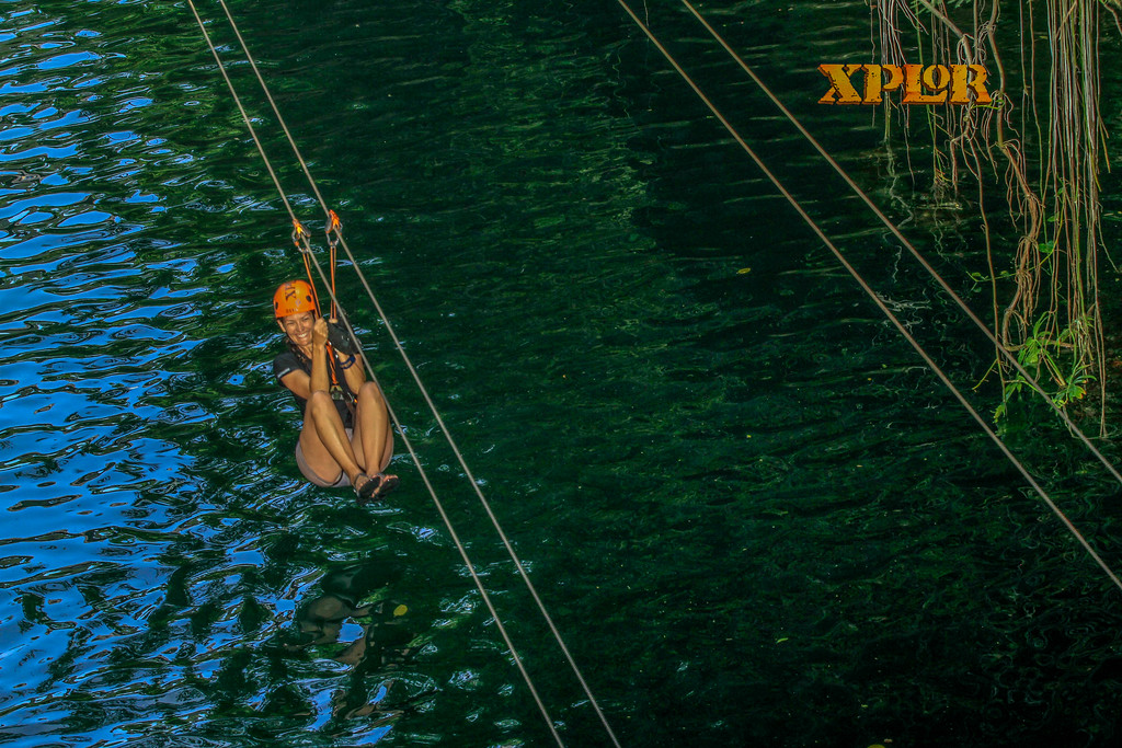 Xplor Park ziplines coast over the water and the jungle