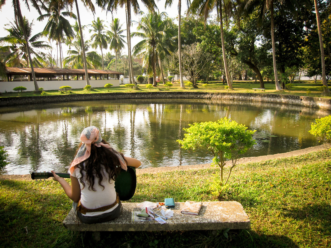 My friend Laura journaling and singing while traveling in Laos.
