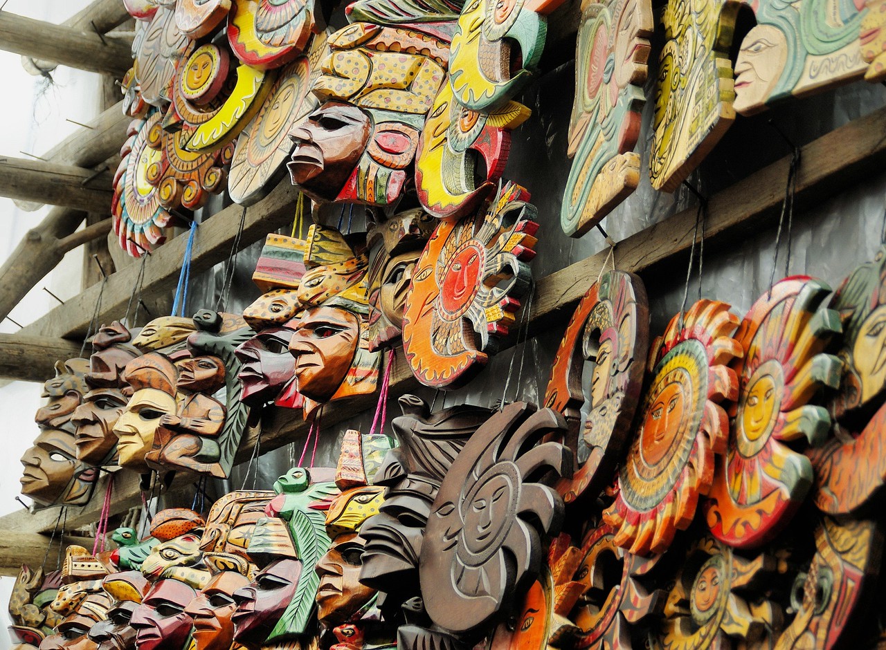 hand-carved wooden masks at chichicastenango market