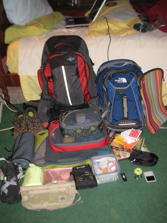 a backpack with everything that fits inside it, including three packing cubes