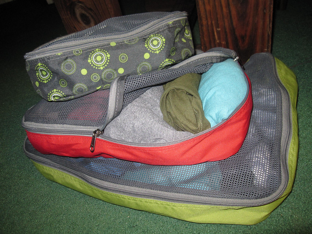 My first set of three packing cubes, with clothes rolled inside