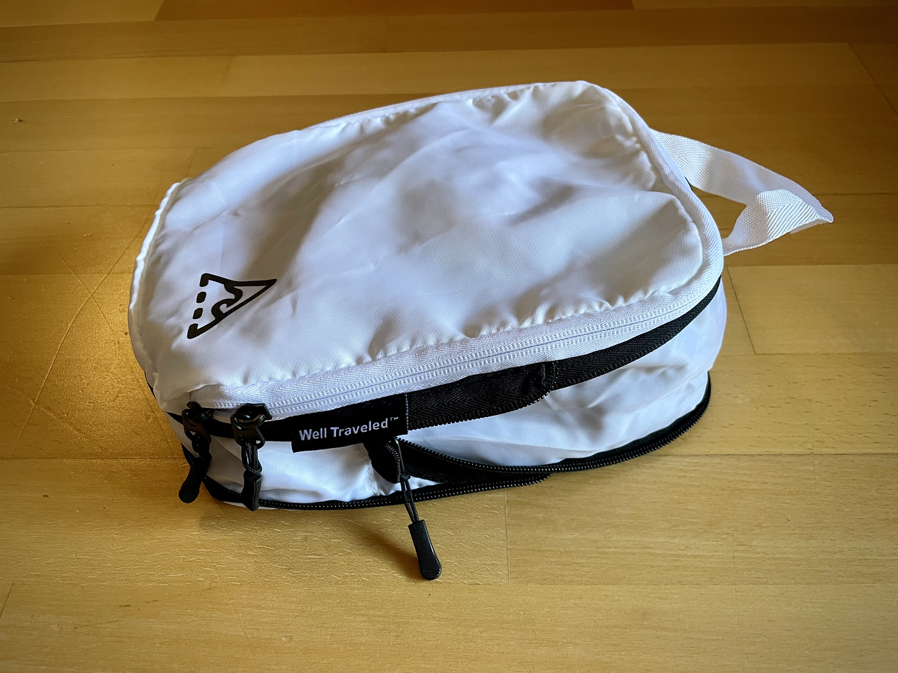 a compression packing cube unzipped and bulky