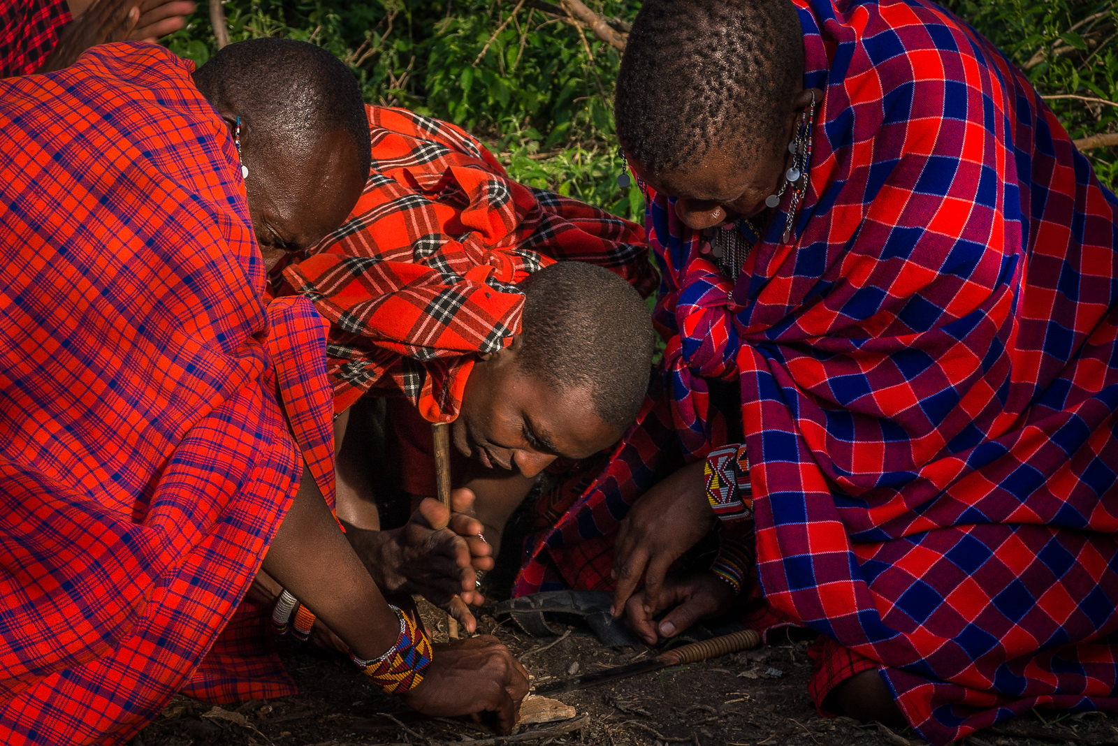 the Maasai lighting a fire by hand