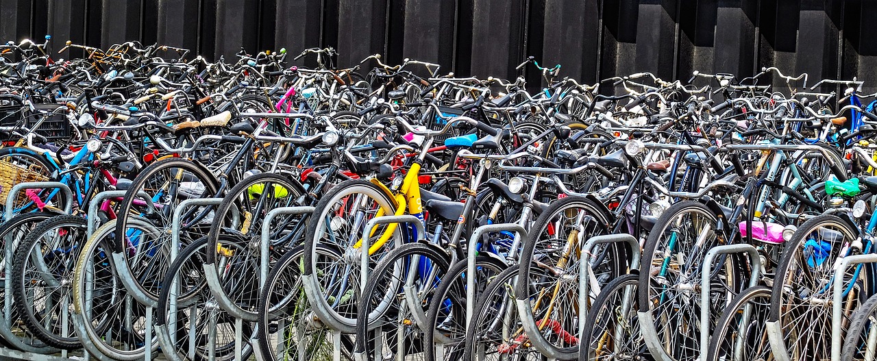 a huge wall of parked bicycles in Amsterdam