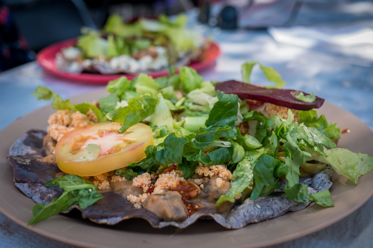 a vegetarian meal on a blue corn tortilla in Oaxaca